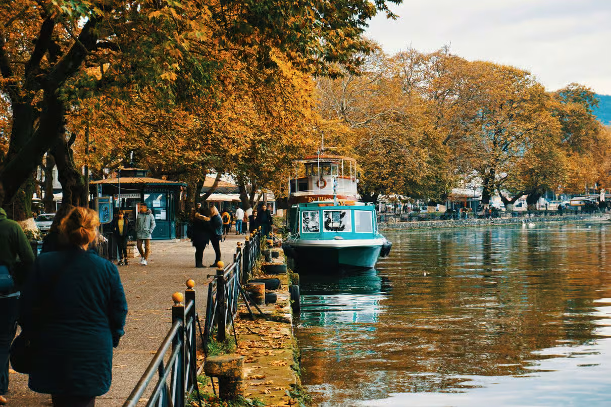 Ioannina lakeside promenade with a traditional boat on Lake Pamvotis